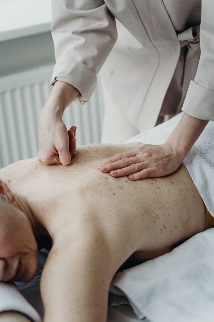 A calming massage session focusing on relaxation and wellness indoors.